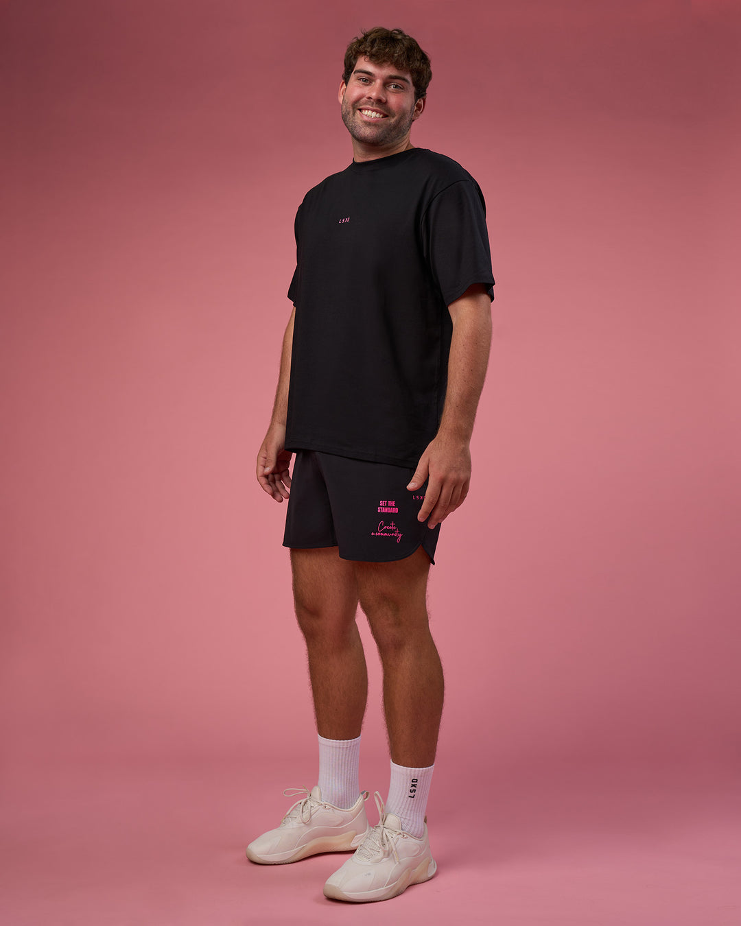Man wearing BCAM FLXCotton Oversized Tee - Black-Ultra Pink | Model:Fletcher | Size:XL