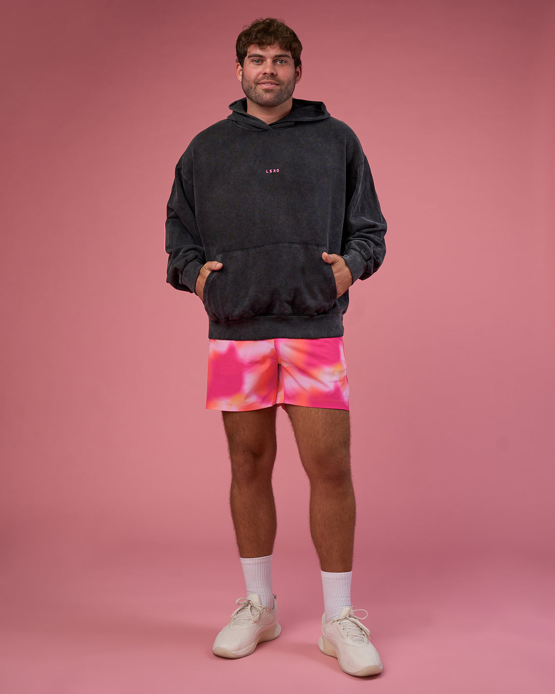 Man wearing BCAM Washed Unisex Oversized Hoodie - Black Washed-Pink | Model:Fletcher | Size:XL
