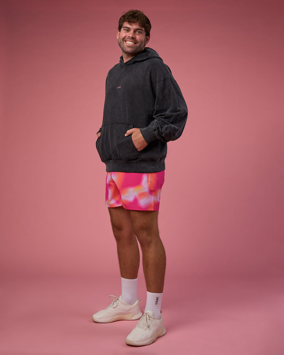 Man wearing BCAM Washed Unisex Oversized Hoodie - Black Washed-Pink | Model:Fletcher | Size:XL