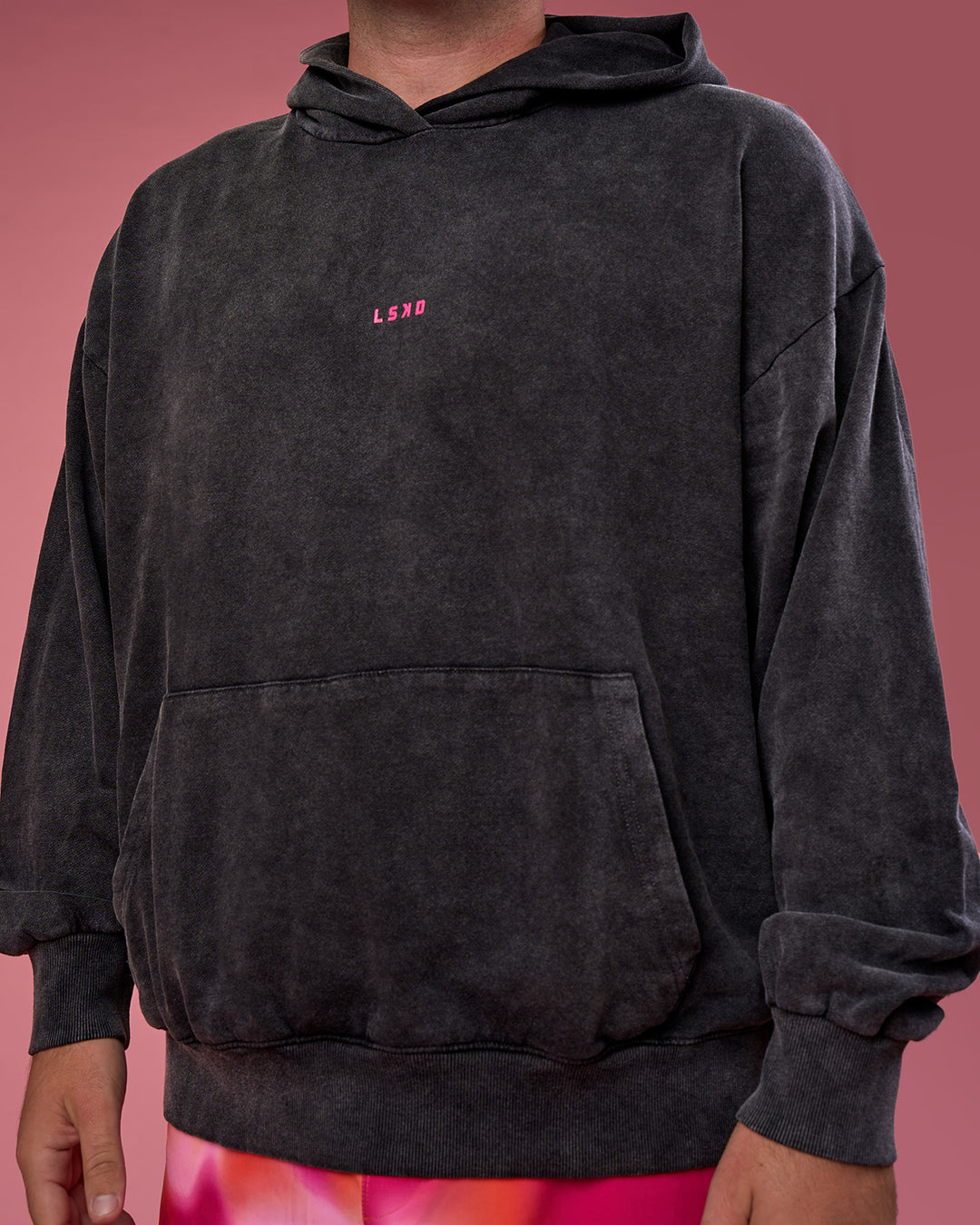 Man wearing BCAM Washed Unisex Oversized Hoodie - Black Washed-Pink | Model:Fletcher | Size:XL