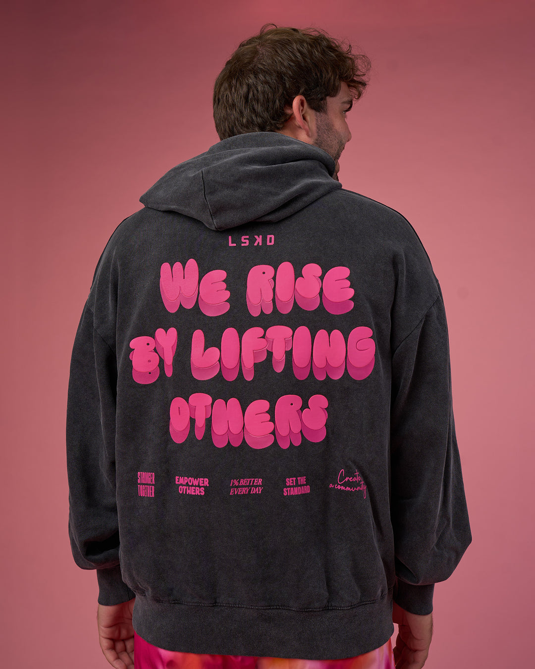 Man wearing BCAM Washed Unisex Oversized Hoodie - Black Washed-Pink | Model:Fletcher | Size:XL