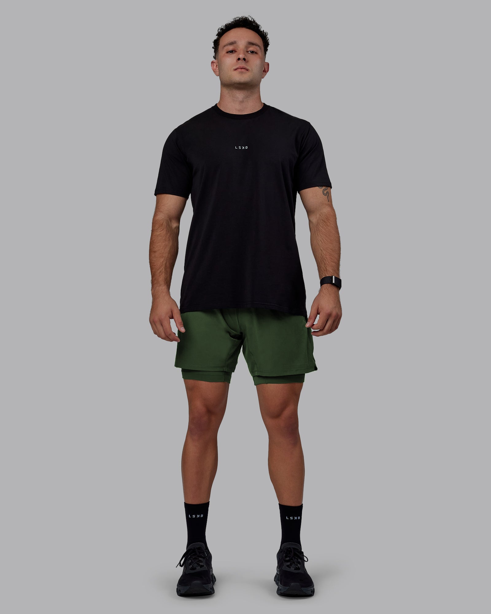 Man wearing Challenger 6" Lined Performance Shorts - Cilantro