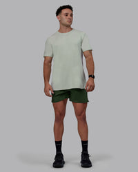 Man wearing Challenger 6" Performance Shorts - Cilantro