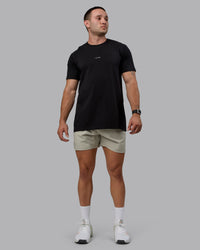 Man wearing Challenger 6" Performance Shorts - Sustained Grey
