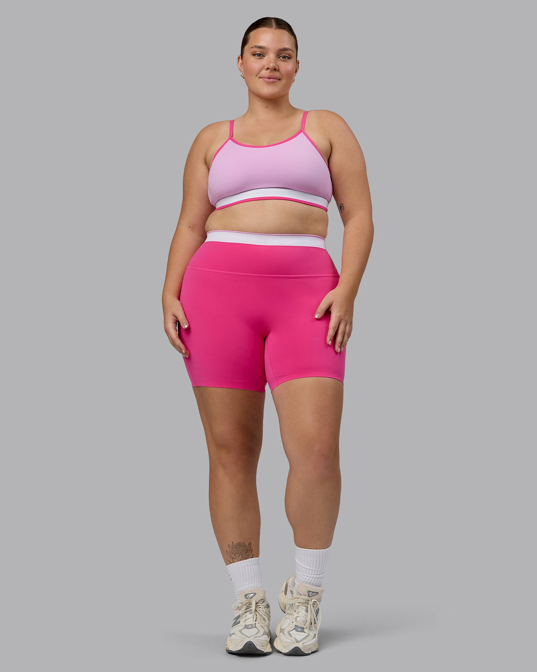 Woman wearing Excel Ultra High-Rise 6&quot; Short - Ultra Pink