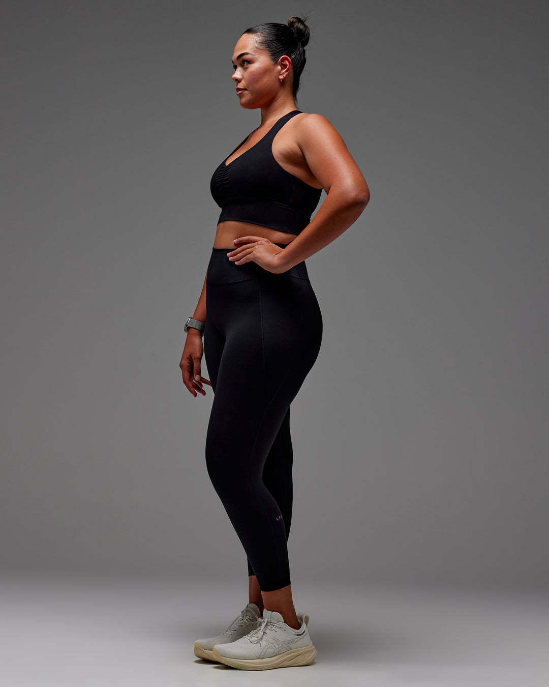 Woman wearing Fusion Ultra High-Rise 7/8 Legging Pockets - Black | Model:Aimee | Size:XL