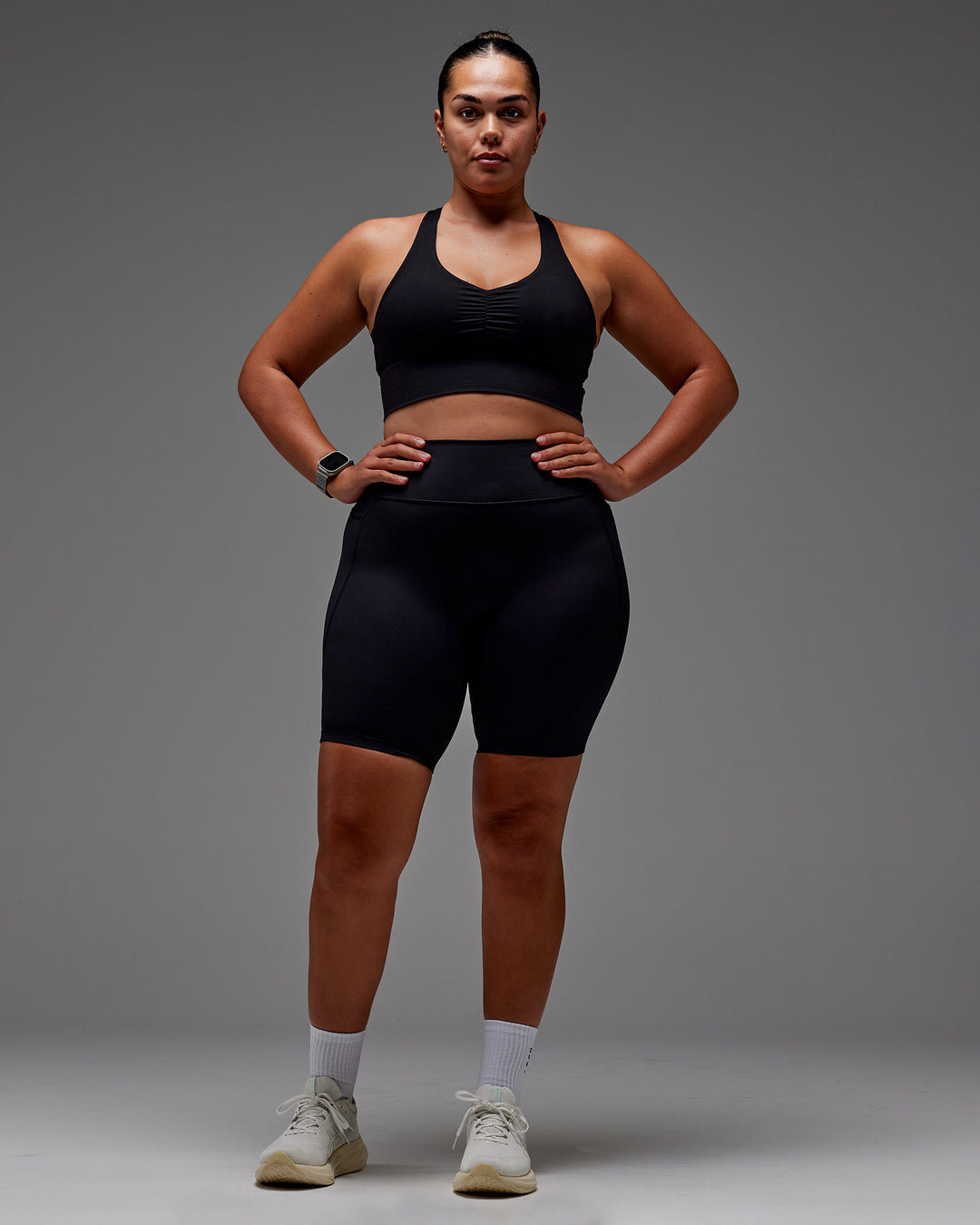Woman wearing Fusion Ultra High-Rise 9&quot; Short Pockets - Black | Model:Aimee | Size:XL