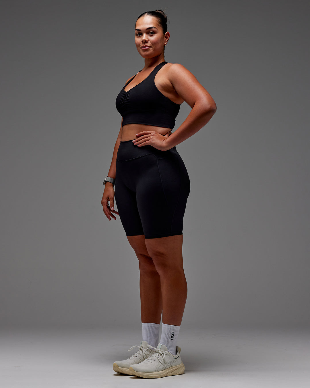 Woman wearing Fusion Ultra High-Rise 9&quot; Short Pockets - Black | Model:Aimee | Size:XL
