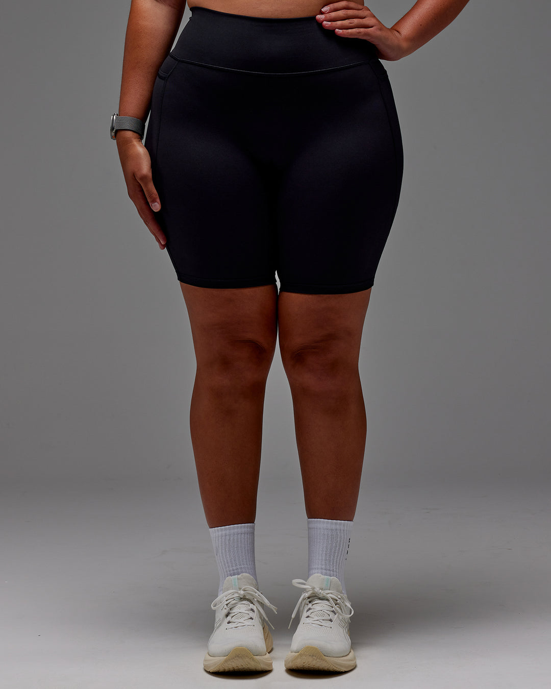 Woman wearing Fusion Ultra High-Rise 9&quot; Short Pockets - Black | Model:Aimee | Size:XL
