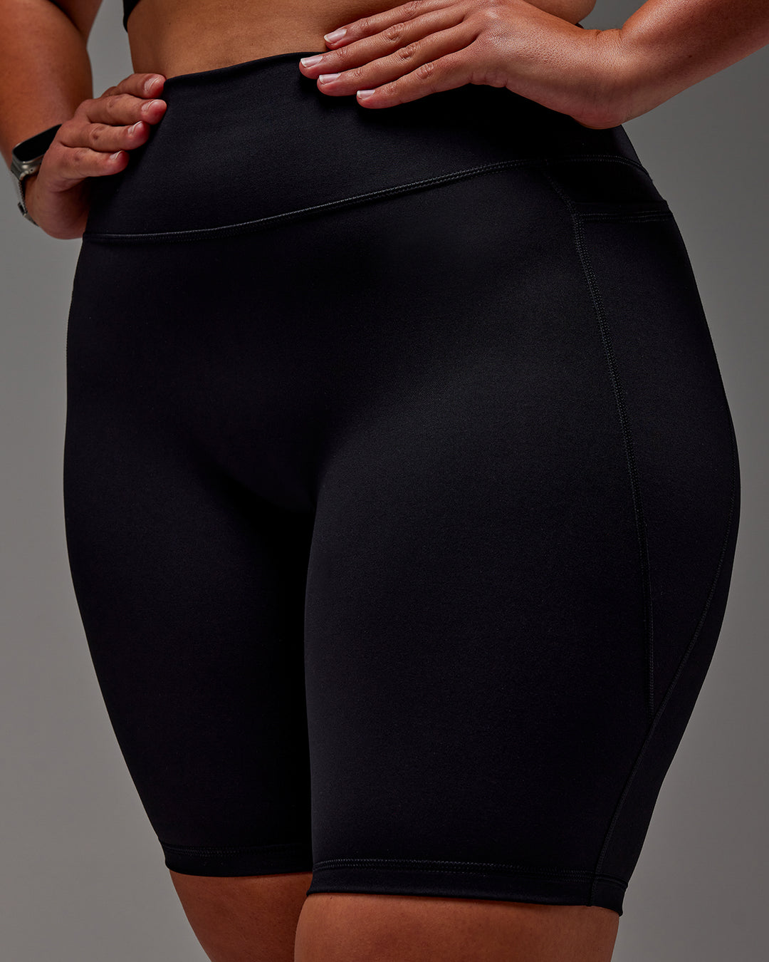 Woman wearing Fusion Ultra High-Rise 9&quot; Short Pockets - Black | Model:Aimee | Size:XL