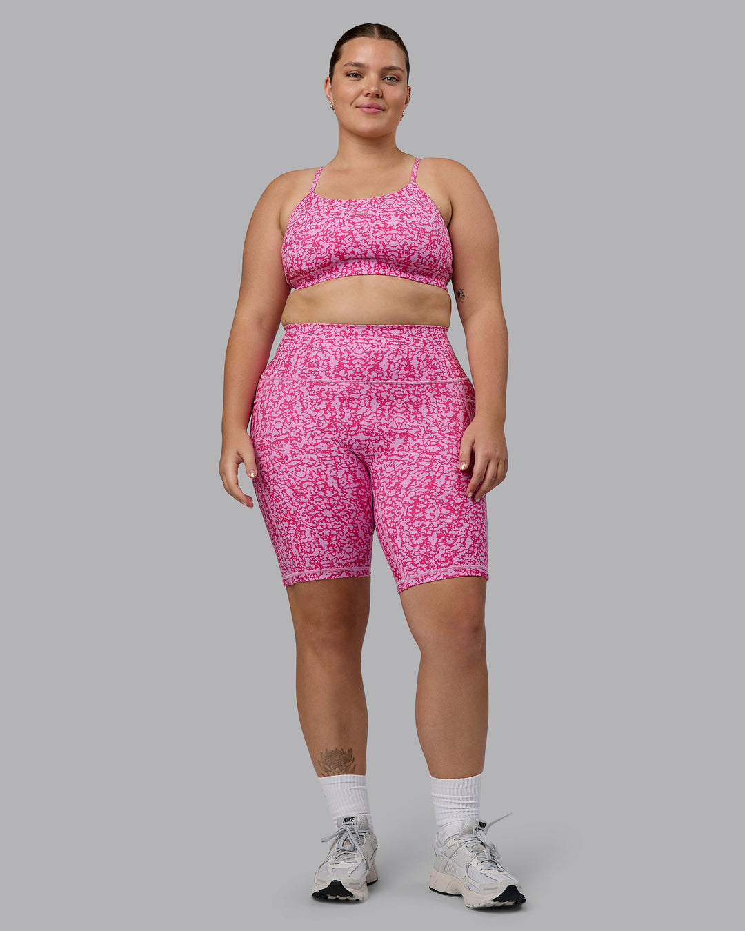 Woman wearing Fusion Ultra High-Rise 9&quot; Short Pockets - Patina-Ultra Pink | Model:Ella | Size:XL