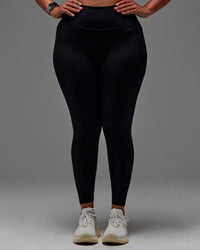Woman wearing Fusion Ultra High-Rise Full Length Legging Pockets - Black | Model:Aimee | Size:XL