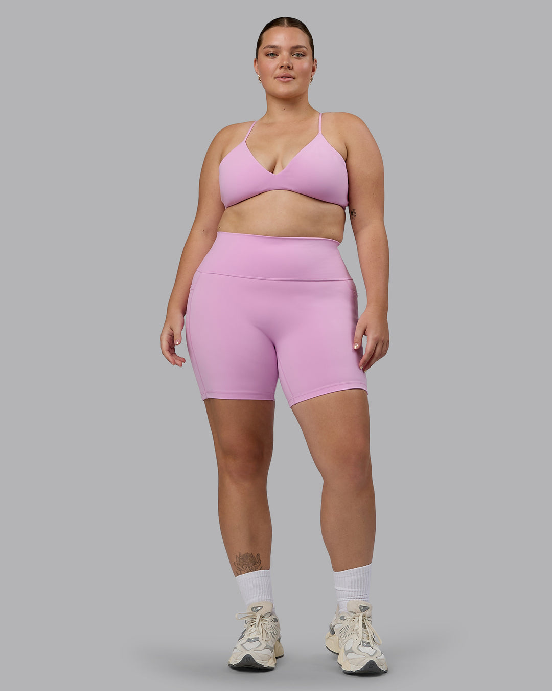 Woman wearing Fusion Ultra High-Rise 6&quot; Short Pockets - Pastel Orchid | Model:Ella | Size:XL