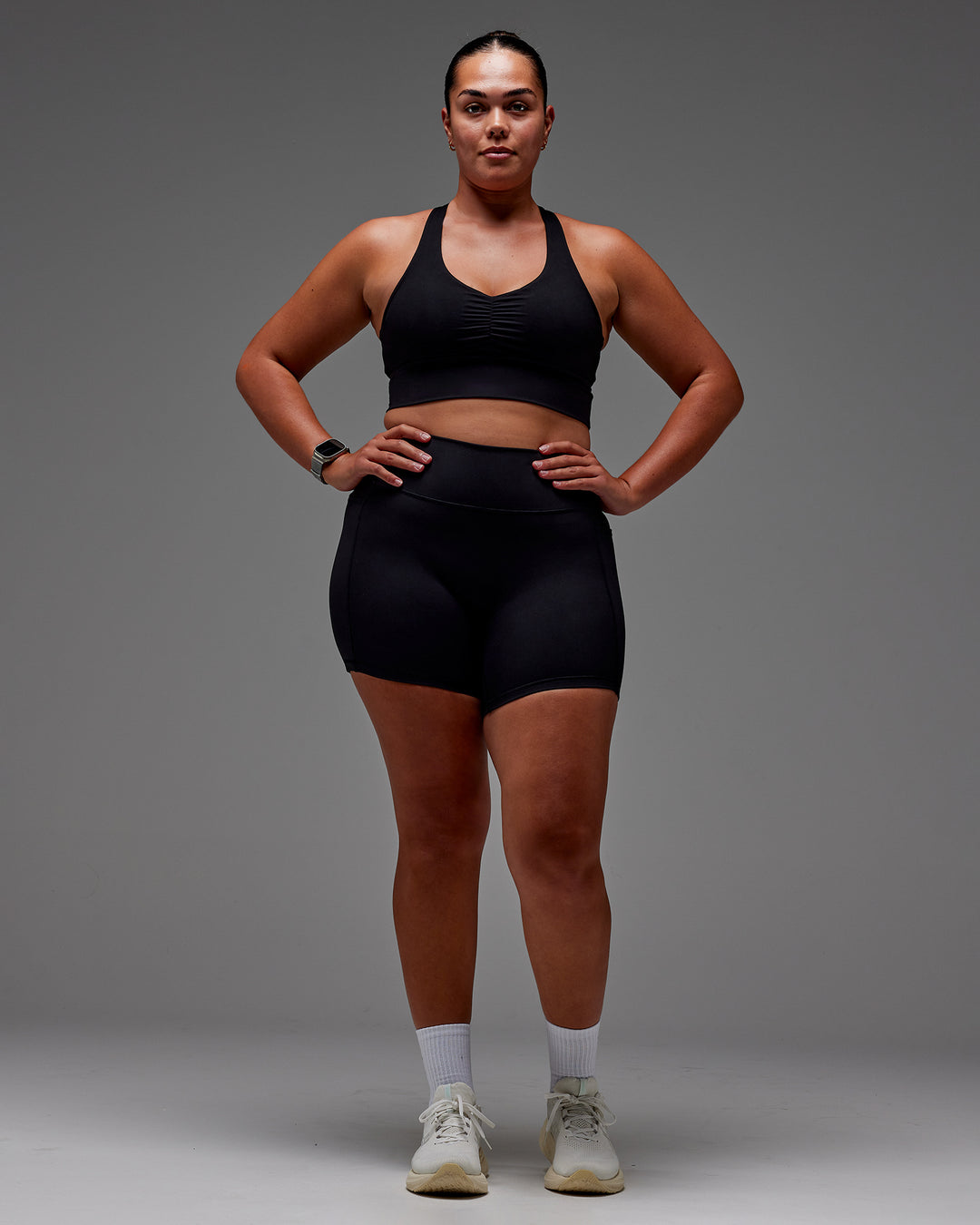 Woman wearing Fusion Ultra High-Rise 6&quot; Short Pockets - Black | Model:Aimee | Size:XL