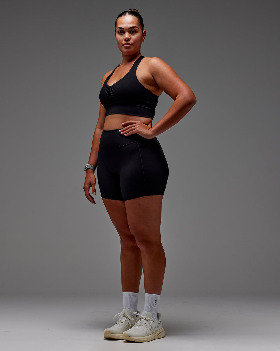 Woman wearing Fusion Ultra High-Rise 6&quot; Short Pockets - Black | Model:Aimee | Size:XL