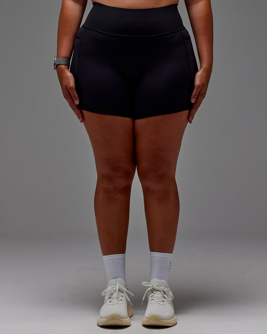 Woman wearing Fusion Ultra High-Rise 6&quot; Short Pockets - Black | Model:Aimee | Size:XL