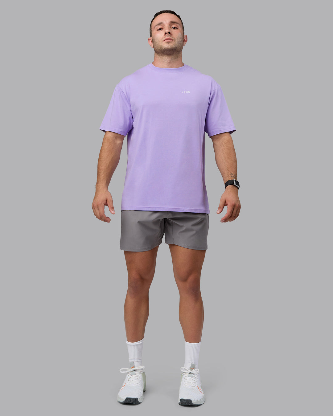 Man wearing Unisex 1% Better Value Series FLXCotton Tee Oversize - Pale Lilac-White