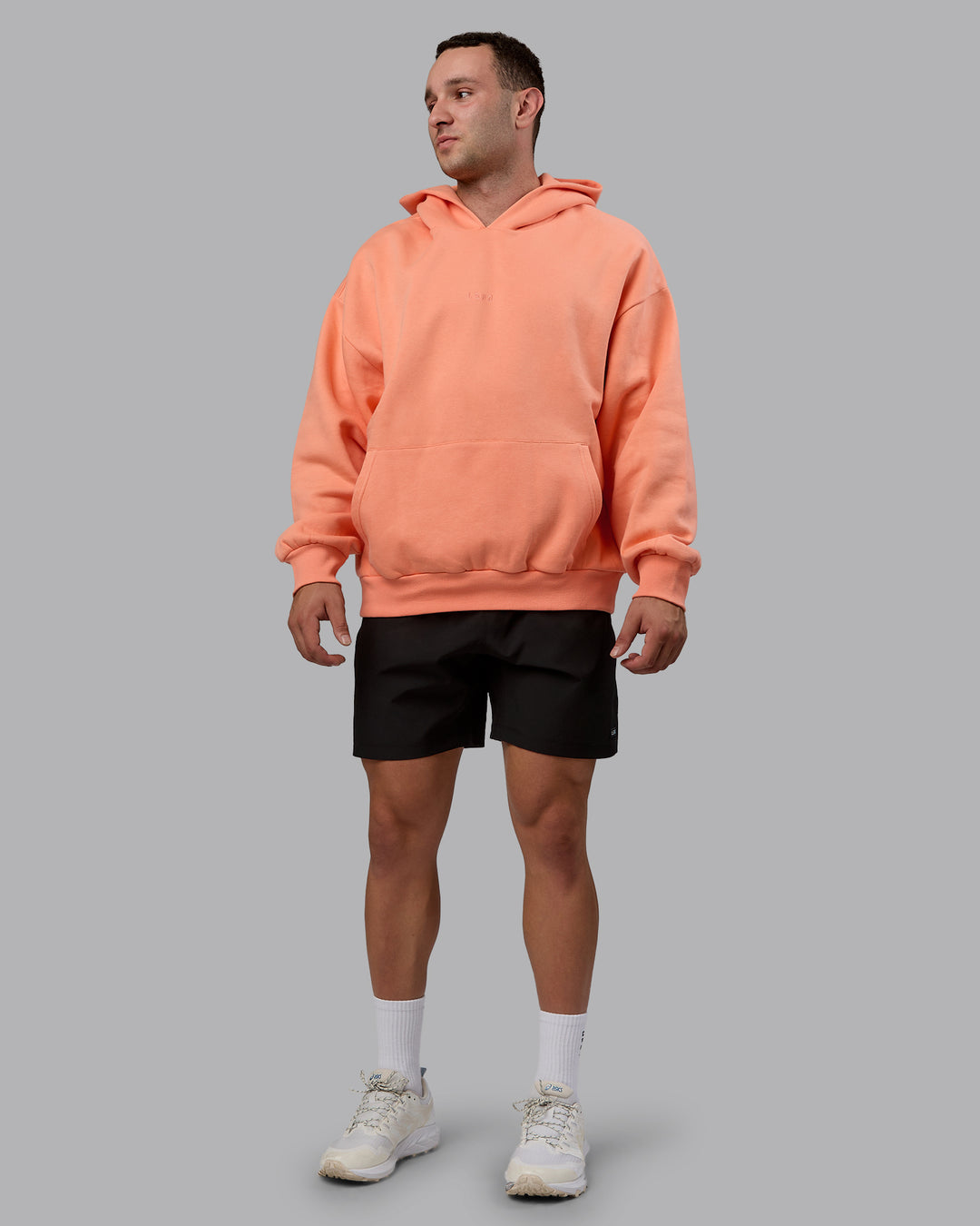 Man wearing Unisex MVP Hoodie Oversize - Mellow Peach