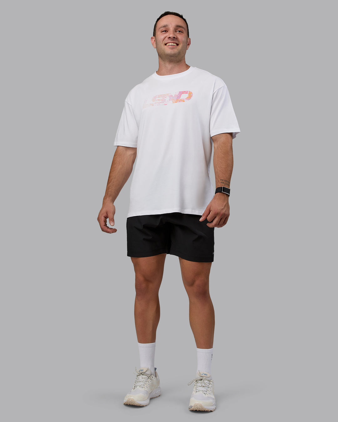 Man wearing Unisex Motion FLXCotton Tee Oversize - White-React Print