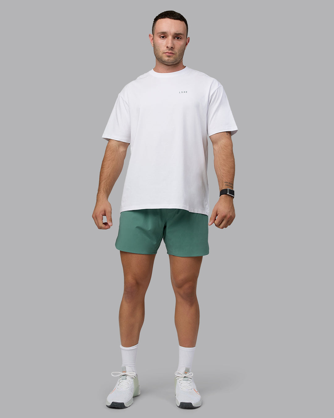 Man wearing Unisex Move Fast Value Series FLXCotton Tee Oversize - White-Sagebrush