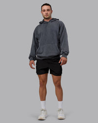 Man wearing Unisex Washed Set the Standard Hoodie Oversize - Black-Greyish Purple