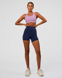 Woman wearing Stability High Support Sports Bra - Light Violet | Model:Charli | Size:XS (A-C Cup)
