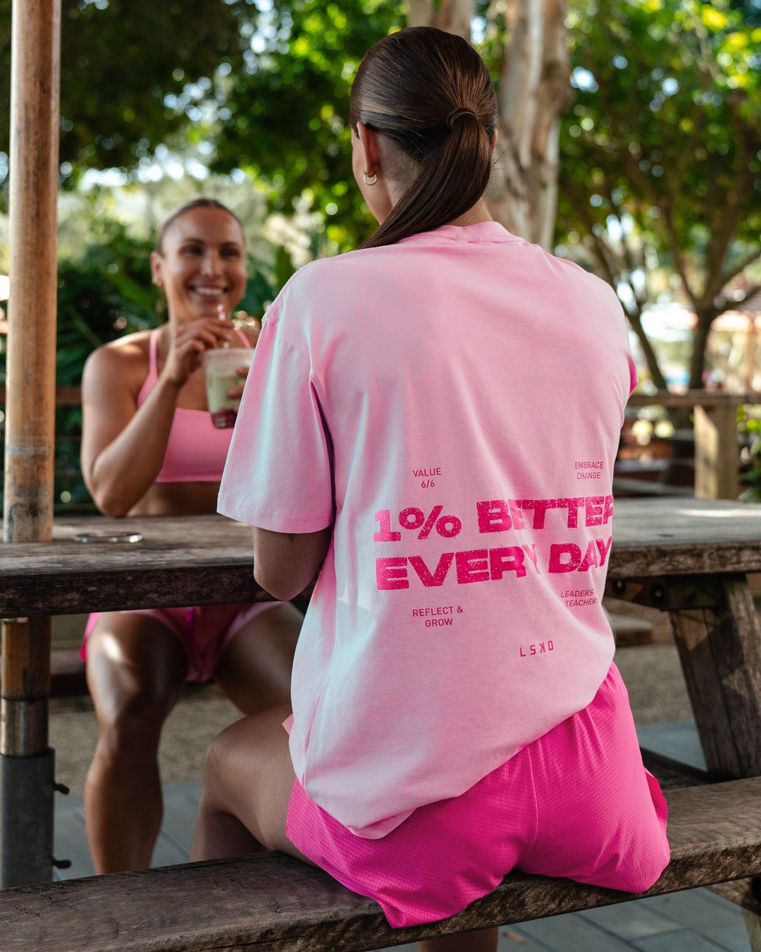 Woman wearing 1% Better Value Series FLXCotton Tee Oversize - Bubblegum-Ultra Pink | Size:XS