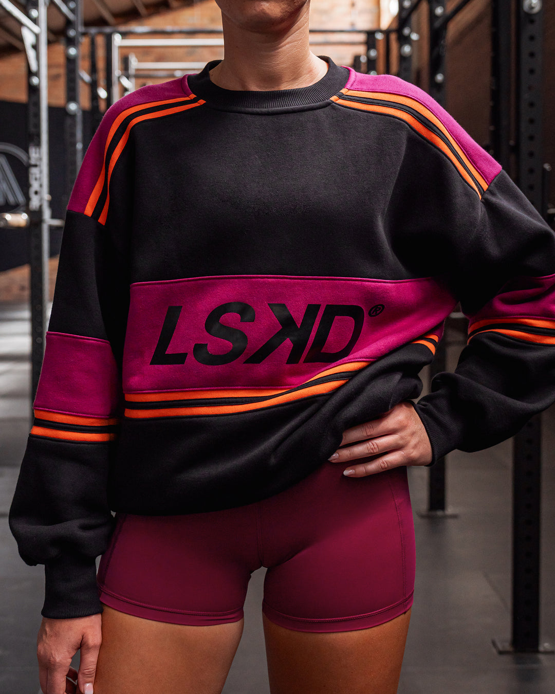 Woman wearing A-Team Sweater Oversize - Black-Plum Berry | Model:Sara | Size:XS