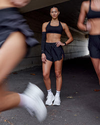 Woman wearing Accelerate 3" High-Rise Running Short - Black | Model:Steph | Size:XS