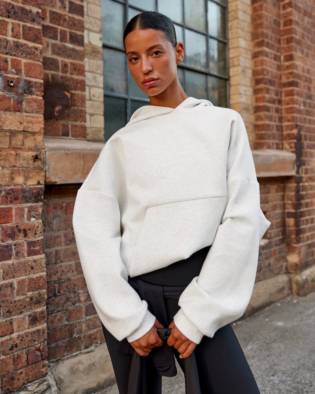 Woman wearing AfterDark ZeroCrease Oversized Hoodie - Silver Marl | Model:Nejilka |Size:XS