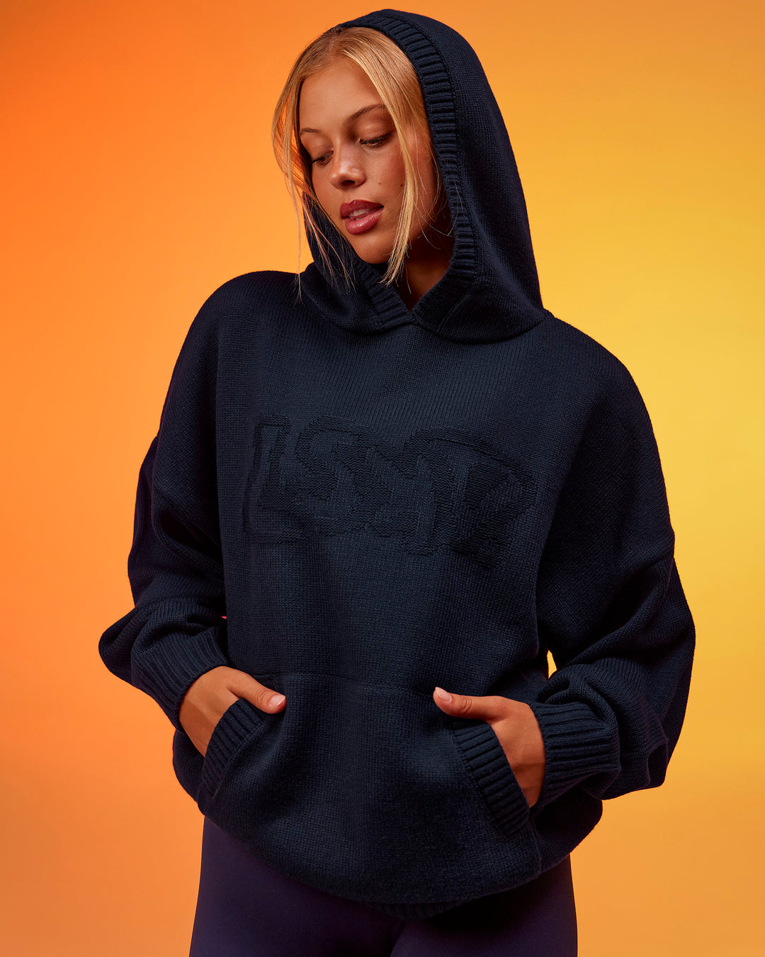 Woman wearing All Day Active Knitted Hoodie - Future Navy | Model:Hailey | Size:XS