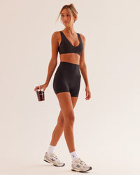 Woman wearing Bend & FLX Plunge Sports Bra - Black | Model:Georgia | Size:XS