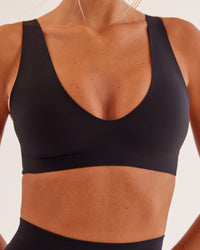 Woman wearing Bend & FLX Plunge Sports Bra - Black | Model:Georgia | Size:XS
