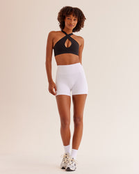 Woman wearing Bend & FLX Plunge Sports Bra - Black | Model:Tomi | Size:XS