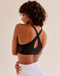 Woman wearing Bend & FLX Plunge Sports Bra - Black | Model:Tomi | Size:XS
