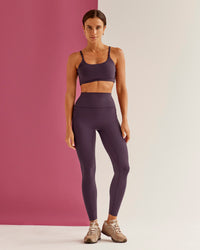 Woman wearing Elixir Ultra High-Rise Full Length Legging Pockets - Midnight Plum | Model:Bruna | Size:XS