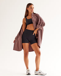 Woman wearing Ember Seamless Sports Bra - Black | Model:Brylee | Size:XS