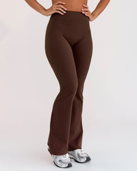 Woman wearing Fusion V-Contour High-Rise Flared Petite Legging Pockets - Hot Chocolate | Model:Brylee | Size:XS