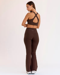 Woman wearing Fusion V-Contour High-Rise Flared Petite Legging Pockets - Hot Chocolate | Model:Brylee | Size:XS