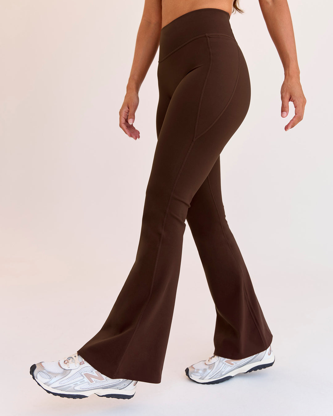 Woman wearing Fusion V-Contour High-Rise Flared Petite Legging Pockets - Hot Chocolate | Model:Brylee | Size:XS