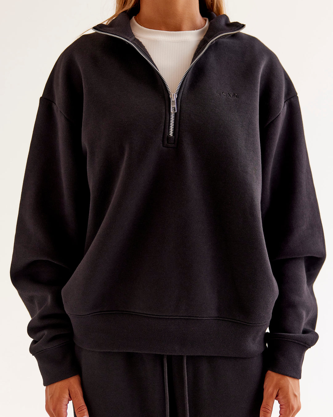 Woman wearing Go-To Oversized Quarter Zip Sweater - Black | Model:Jaimee | Size:XS