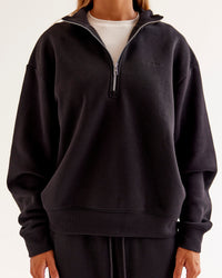 Woman wearing Go-To Oversized Quarter Zip Sweater - Black | Model:Jaimee | Size:XS