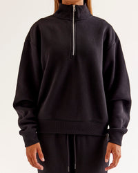 Woman wearing Go-To Oversized Quarter Zip Sweater - Black | Model:Jaimee | Size:XS