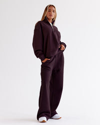 Woman wearing Go-To Oversized Quarter Zip Sweater - Midnight Plum | Model:Jaimee | Size:XS