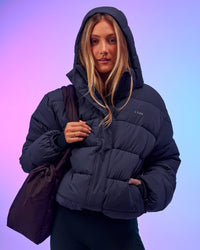 Woman wearing Go-To Puffer Jacket - Future Navy | Model:Georgia | Size:XS | Thumbnail Index: 0