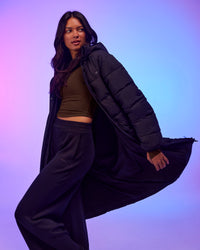Woman wearing Go-To Puffer Long Jacket - Black | Model:Alex | Size:XS