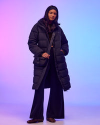 Woman wearing Go-To Puffer Long Jacket - Black | Model:Alex | Size:XS