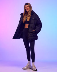 Woman wearing Go-To Puffer Mid Jacket - Black | Model:Georgia | Size:XS