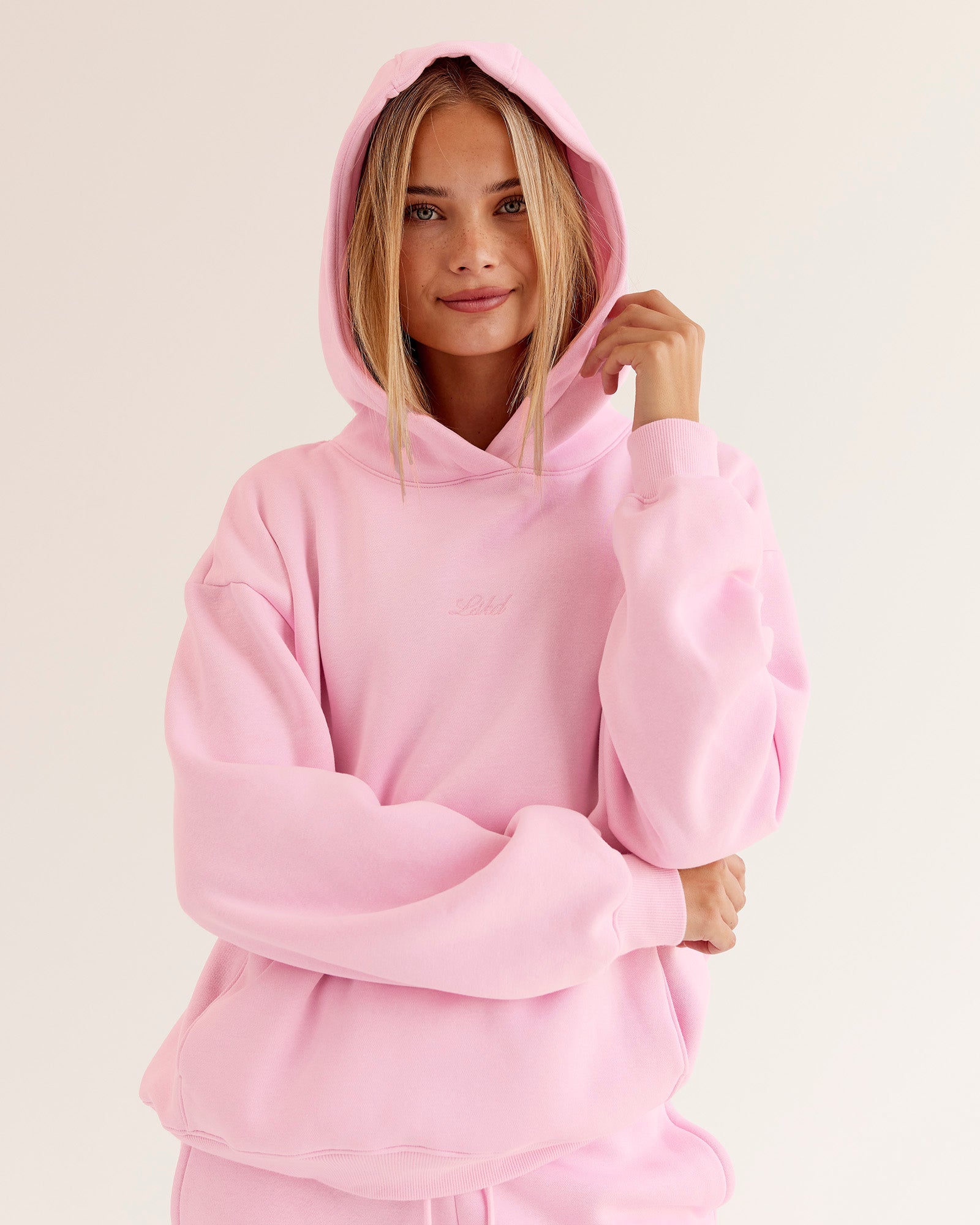 Woman wearing Go-To Script Oversized Hoodie - Marshmallow | Model:Taneisha | Size:XS