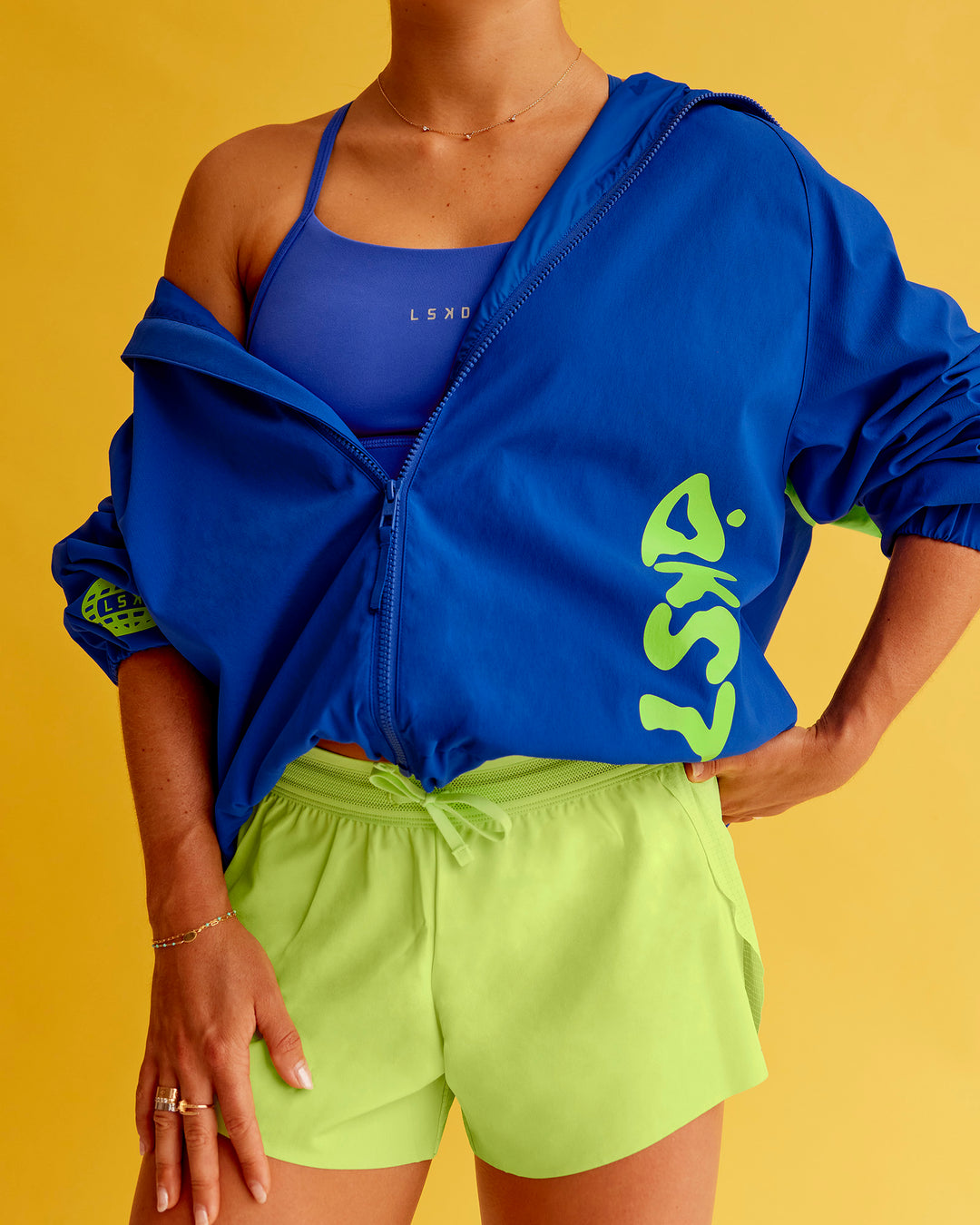 Woman wearing Hype Oversized Track Jacket - Electric Indigo | Model:Bella | Size:XS